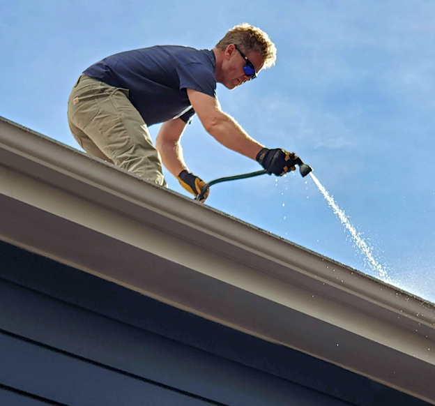 Photo: PEAK Window Cleaning ensures that gutters are flowing and not clogged.
