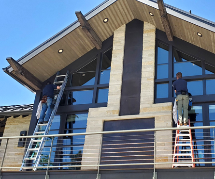 Photo: even the high windows get detailed by PEAK Window Cleaning.